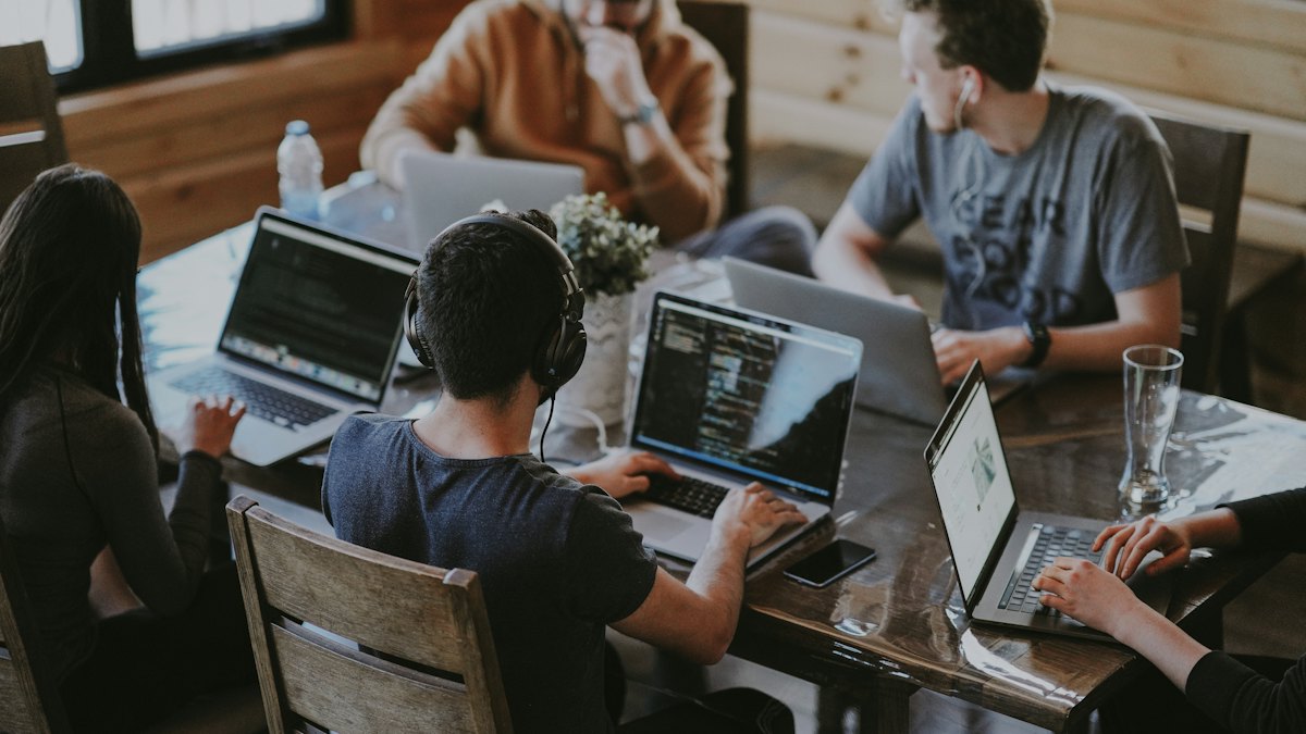 A team working on laptops
