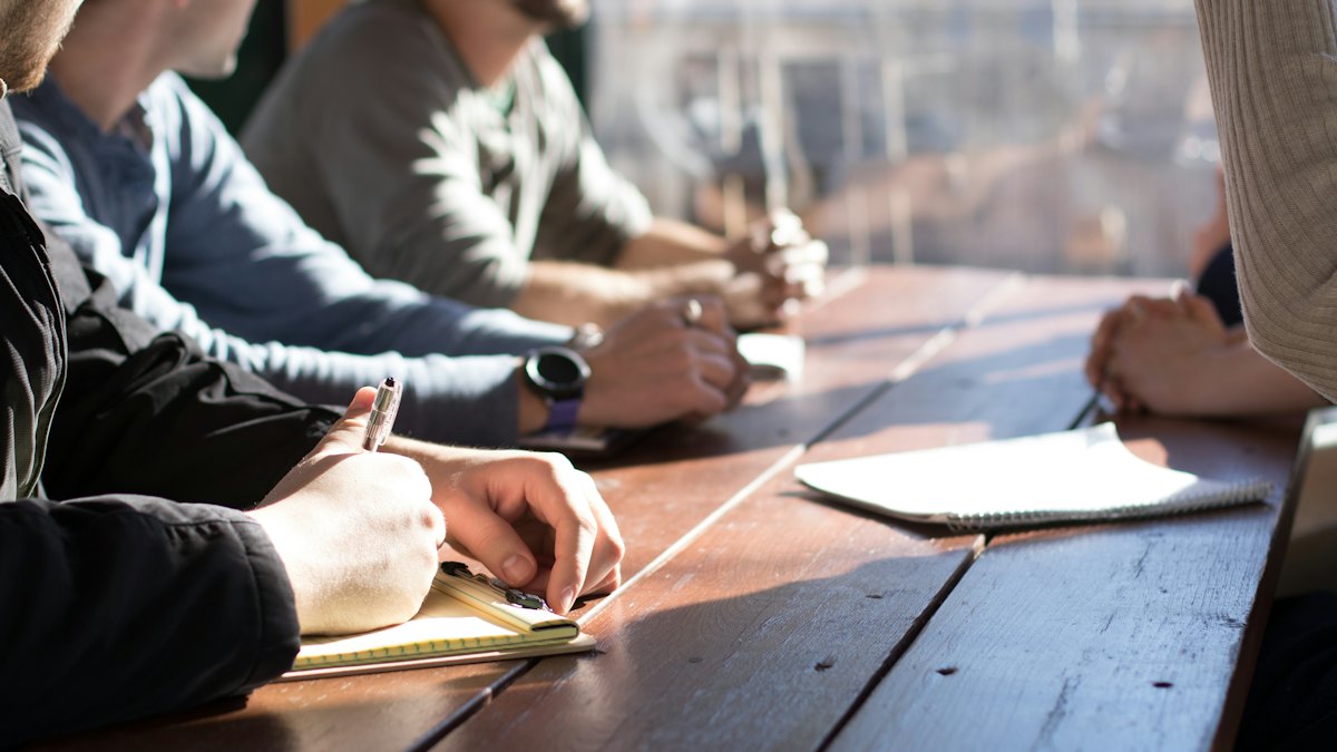 People at a table with papers
