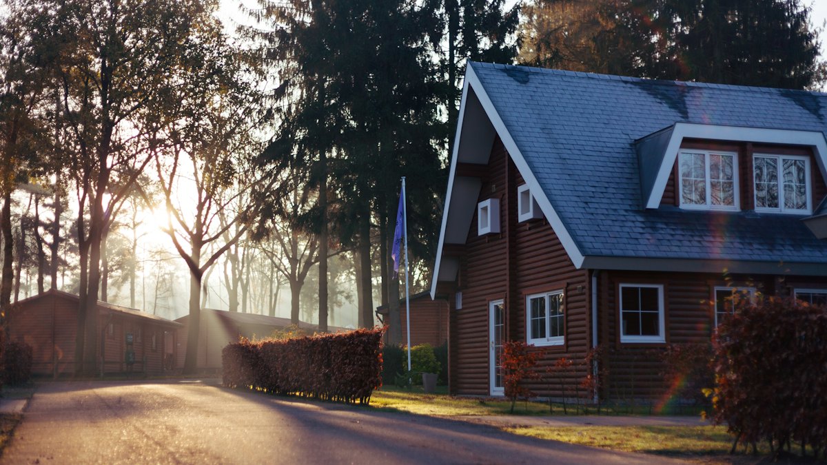 A brick house among trees