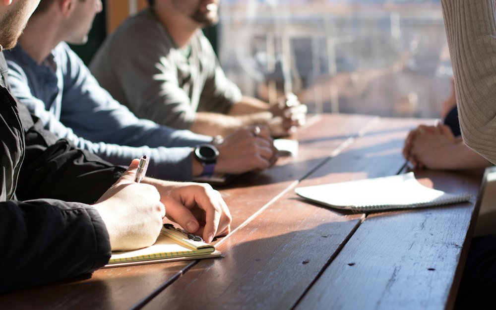 People at a table with papers
